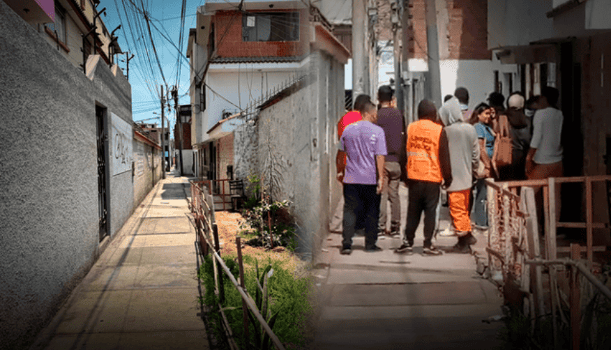 Patio estrecho y calle residencial en Loreto Noticias con grupo de personas caminando en zona urbana en Loreto, Perú, en entorno de barrio popular y con infraestructura urbana básica, noticias locales.