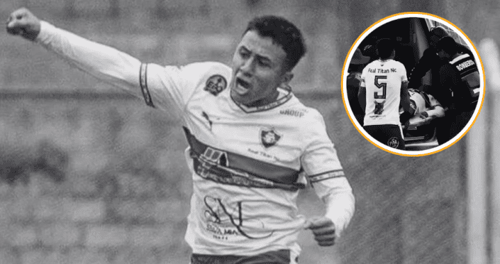 Acción de un futbolista celebrando un gol en un partido de fútbol peruano, con fondo de césped y público.